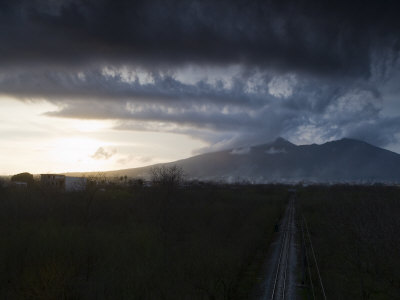 A Railway Runs Through An Area Near The Crater Of Mount Vesuvius by Robert Clark Pricing Limited Edition Print image