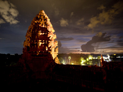 Illuminated At Night, A Lotus Bud-Shaped Tower Gleams At Angkor Wat by Robert Clark Pricing Limited Edition Print image