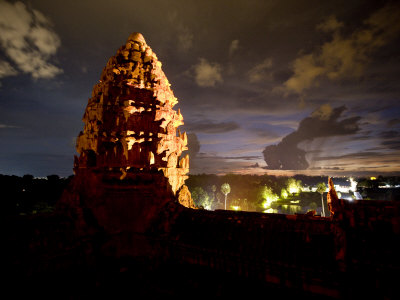 Illuminated At Night, A Lotus Bud-Shaped Tower Gleams At Angkor Wat by Robert Clark Pricing Limited Edition Print image