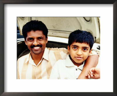 Portrait Of Father And Son On Car At Devaraja Market, Mysore, India by Michael Taylor Pricing Limited Edition Print image
