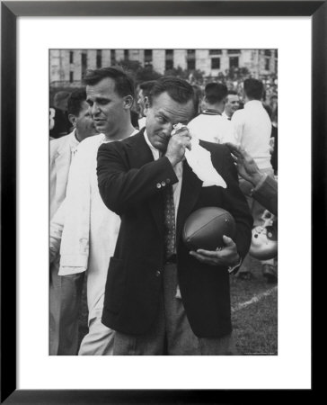 Football Coach Jack Freeman Holding Ball Weeps With Joy After His Team by Hank Walker Pricing Limited Edition Print image