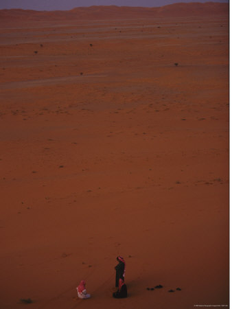 Two Men Meet In The Sand Dunes Of The Arabian Desert by Reza Pricing Limited Edition Print image