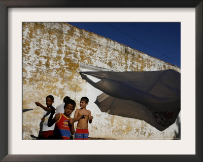 A Group Of Children Fly Plastic Bags, Known As Papalotes by Javier Galeano Pricing Limited Edition Print image