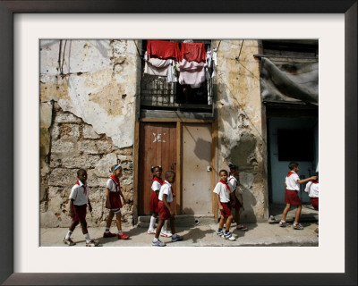 Cuban Students Walk Along A Street In Old Havana, Cuba, Monday, October 9, 2006 by Javier Galeano Pricing Limited Edition Print image