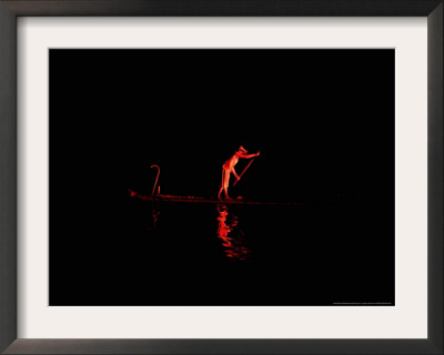 A Chinese Actor Dressed As Fisherman Performs On A Bamboo Raft During An Outdoor Performance by Elizabeth Dalziel Pricing Limited Edition Print image