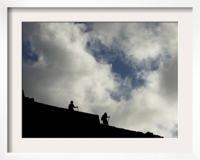 Two Tourists Walk In The Ruins Of Machu Pichu, Peru by Tomas Munita Pricing Limited Edition Print image