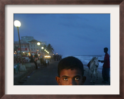 A Sri Lankan Boy Looks As He Sells Prawns At The Sea Front, In Colombo, Sri Lanka, June 30, 2006 by Manish Swarup Pricing Limited Edition Print image