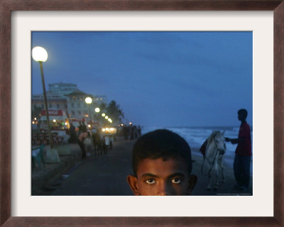 A Sri Lankan Boy Looks As He Sells Prawns At The Sea Front, In Colombo, Sri Lanka, June 30, 2006 by Manish Swarup Pricing Limited Edition Print image