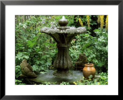 Stone Fountain In Garden With Small Sculptures And Ligularia Prezewalskii (Leopard Plant) Summer by Jean-Claude Hurni Pricing Limited Edition Print image