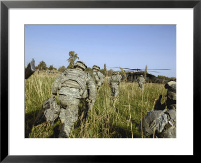 Us Army Soldiers Prepare To Board A Uh-60 Black Hawk Helicopter by Stocktrek Images Pricing Limited Edition Print image