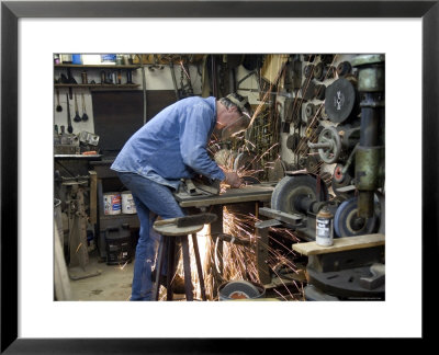 Man Works In His Shop On A Family Farm In Nebraska by Joel Sartore Pricing Limited Edition Print image