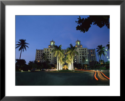 Twilight View Of Building With Palm Trees In Cuba by Steve Winter Pricing Limited Edition Print image
