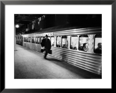 Commuter On The New York New Haven Line Running To Catch Train Pulling Out Of Grand Central Station by Alfred Eisenstaedt Pricing Limited Edition Print image