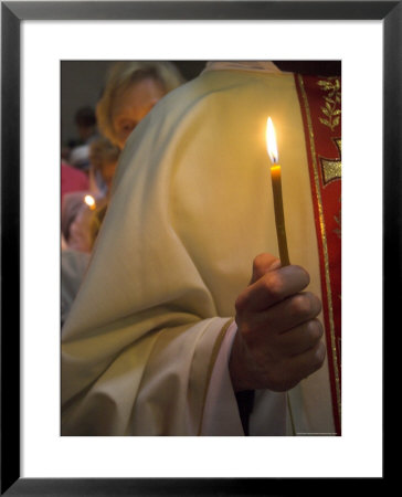 A Priest's Hand Holding A Candle During Mass In Easter Week, Old City, Israel by Eitan Simanor Pricing Limited Edition Print image