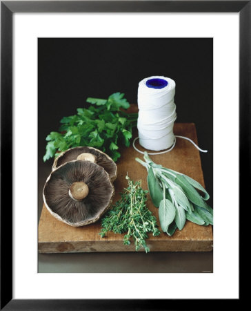 Mushrooms, Fresh Herbs & Kitchen String On Chopping Board by Michael Paul Pricing Limited Edition Print image
