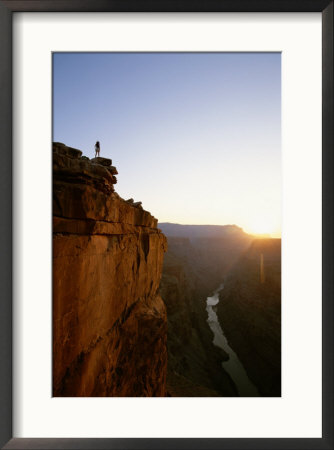 A Hiker Surveys The Grand Canyon From Atop Toroweap Overlook by John Burcham Pricing Limited Edition Print image