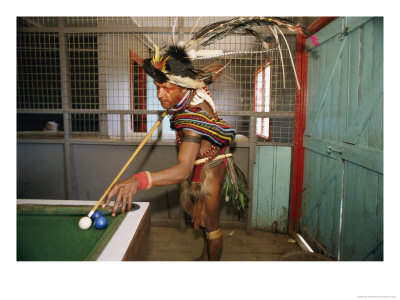 A Huli Wigman Plays Pool In A Pub During The Annual Sing-Sing In Goroka by Jodi Cobb Pricing Limited Edition Print image