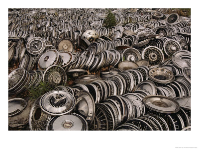 A Field Of Chrome-Plated Choices Offers Hubcap Heaven To Buyers by Stephen St. John Pricing Limited Edition Print image