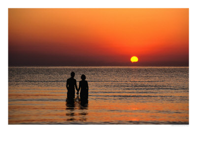 Couple Holding Hands At Sunset Over The Bay Of Alcudia, Mallorca, Balearic Islands, Spain by David Tomlinson Pricing Limited Edition Print image