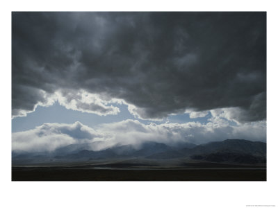 Storm Clouds Brew Over The Panamint Range And Salt Pan In Death Valley by Gordon Wiltsie Pricing Limited Edition Print image