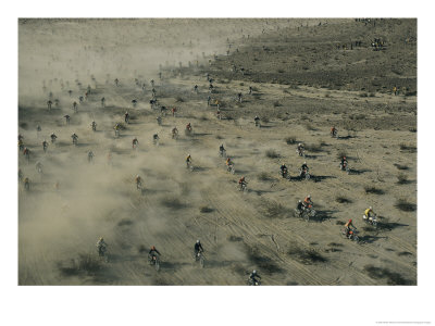 Aerial View Of Hundreds Of Motorcyclists Racing Across The Mojave Desert by Walter Meayers Edwards Pricing Limited Edition Print image