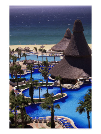 Swimming Pool And Palapas, Cabo San Lucas, Mexico by Walter Bibikow Pricing Limited Edition Print image