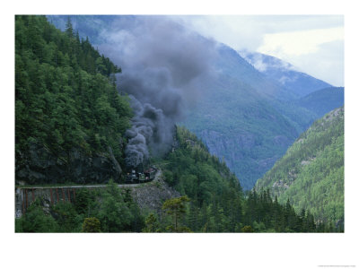 Smoke Billows From A Train On White Pass And Yukon Route Railroad by Michael Melford Pricing Limited Edition Print image