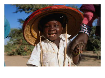Young Smiling Boy Wearing A Typical Mali Hat And Holding His Mother's Hand, Djenne, Mopti, Mali by Jane Sweeney Pricing Limited Edition Print image