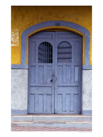 A Smokey Grey Wooden Door Of A Painted Colonial House, Granada,Granada, Nicaragua by Alfredo Maiquez Pricing Limited Edition Print image