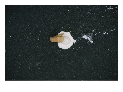 A Scoop Of Vanilla Ice Cream In A Cone Melts On Asphalt Pavement by Jodi Cobb Pricing Limited Edition Print image
