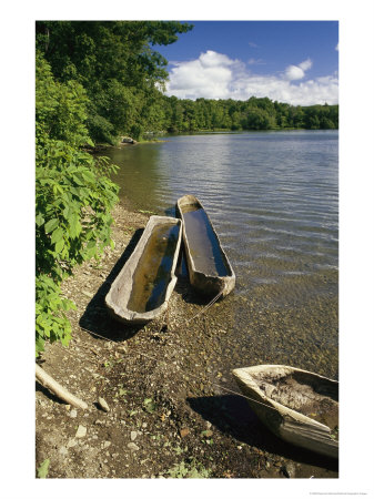 Log Canoes On The Banks Of A Recreated Iroquois Fishing Camp by Raymond Gehman Pricing Limited Edition Print image