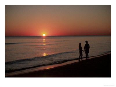 Silhouette Of Couple On Beach At Sunset, Fl by Pat Canova Pricing Limited Edition Print image