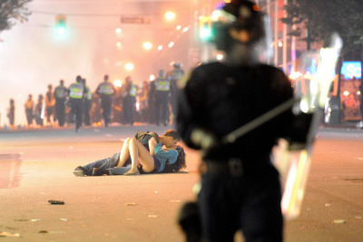 Couple Kisses During Vancouver Riot After The Canucks' Nhl Championship Loss: June 15 2011 by Richard Lam Pricing Limited Edition Print image
