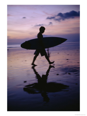A Surfer Walks Along Kuta Beach At Dusk With His Surfboard In Hand by Eightfish Pricing Limited Edition Print image
