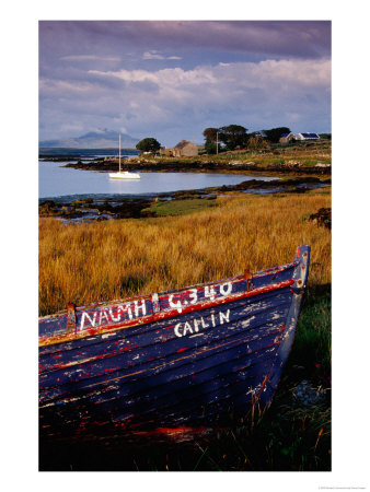 Rowboat Hauled Up On Shore Of Inlet With Moored Yacht, Ireland by Richard Cummins Pricing Limited Edition Print image
