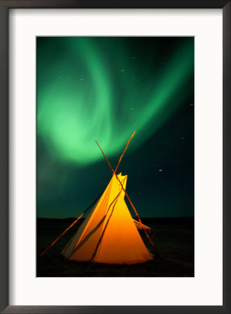 A Solitary Tepee Is Illuminated By The Aurora Borealis by Raymond Gehman Pricing Limited Edition Print image