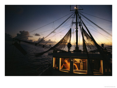View From A Fishing Boat At Sea, The Captain Is Visible In The Cabin by Ira Block Pricing Limited Edition Print image