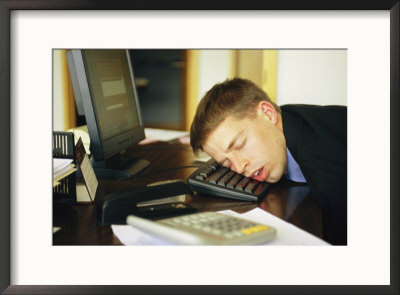 A Man Sleeps With His Head On His Computer Keyboard by Joel Sartore Pricing Limited Edition Print image
