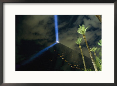 The Top Of The Luxor Hotel Pyramid Projects Holograms Onto A Fountain Nightly by Maria Stenzel Pricing Limited Edition Print image