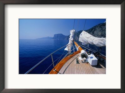 Deck Of Yacht Sailing Past Cliffs Of Gulf Of Orosei, Sardinia, Italy by Dallas Stribley Pricing Limited Edition Print image