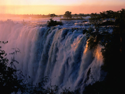 Victoria Falls At Sunset From Zambia, Victoria Falls, Zambia by Dennis Johnson Pricing Limited Edition Print image