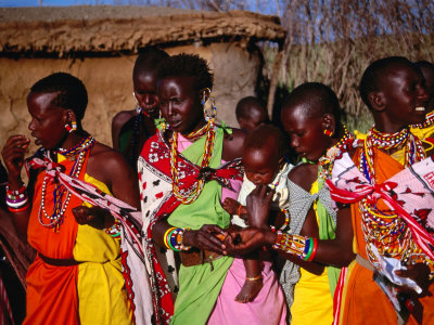 Group Of Masai Women In Traditional Dress, Masai Mara National Reserve, Rift Valley, Kenya by Mitch Reardon Pricing Limited Edition Print image