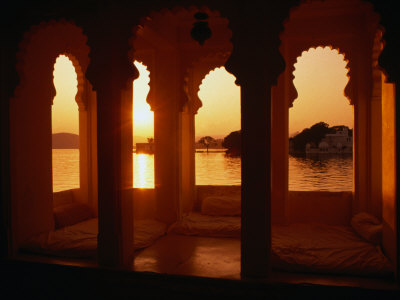 Sunset Over Lake Pichola Seen Through Arch Windows Of Jagat Niwas Hotel, Udaipur, Rajasthan, India by Dallas Stribley Pricing Limited Edition Print image
