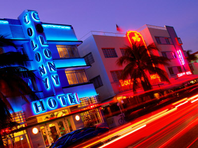 Car Light Trails Passing Neon Lights Of Art Deco Hotels On Ocean Drive, South Beach, Miami, Florida by Eddie Brady Pricing Limited Edition Print image