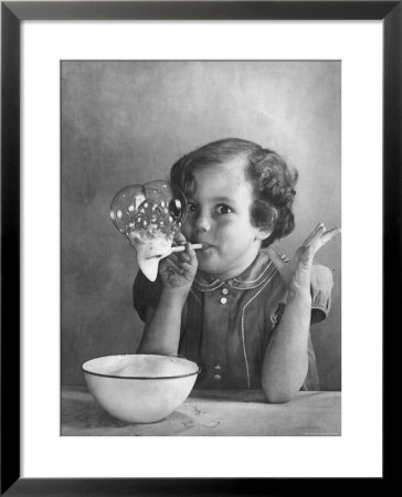Girl Blowing Soap Bubbles by Gjon Mili Pricing Limited Edition Print image
