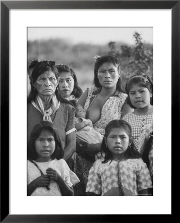 Family Of Guarani Indian Women With Mother Breast Feeding An Infant by Leonard Mccombe Pricing Limited Edition Print image