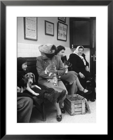 Women And Children Holding Pets While Waiting To See Veterinarian by Nina Leen Pricing Limited Edition Print image