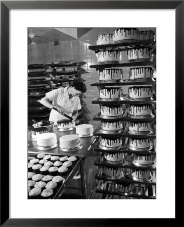Woman Frosting Cakes At Schrafft's In Rockefeller Center by Cornell Capa Pricing Limited Edition Print image