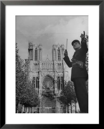 Policeman Directing Traffic In Front Of The Reims Cathedral by Nat Farbman Pricing Limited Edition Print image