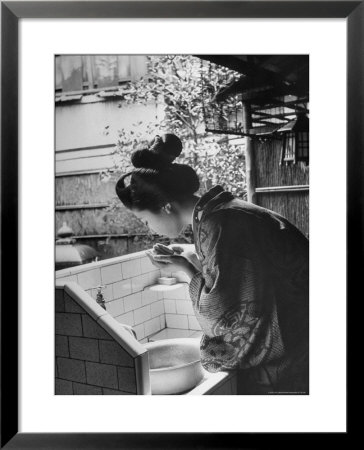 Novice Geisha Washing Her Face At A Basin by Alfred Eisenstaedt Pricing Limited Edition Print image